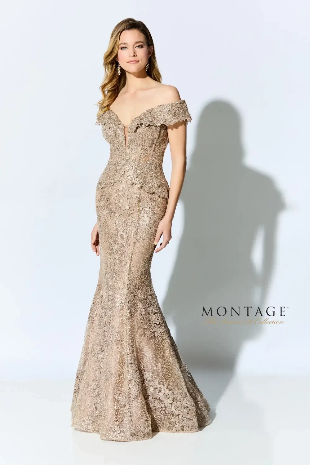 A woman wearing a stunning off-the-shoulder evening gown that is intricately designed with lace and has a mermaid silhouette. The dress features a fitted bodice and flares out at the bottom, showcasing a glamorous style.